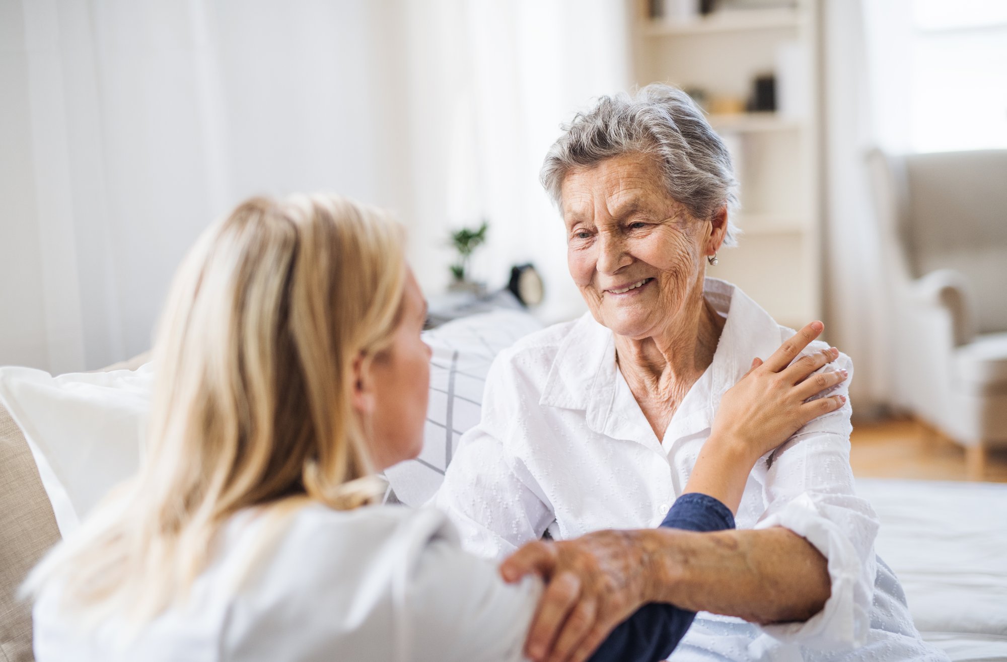 Older and younger woman embracing