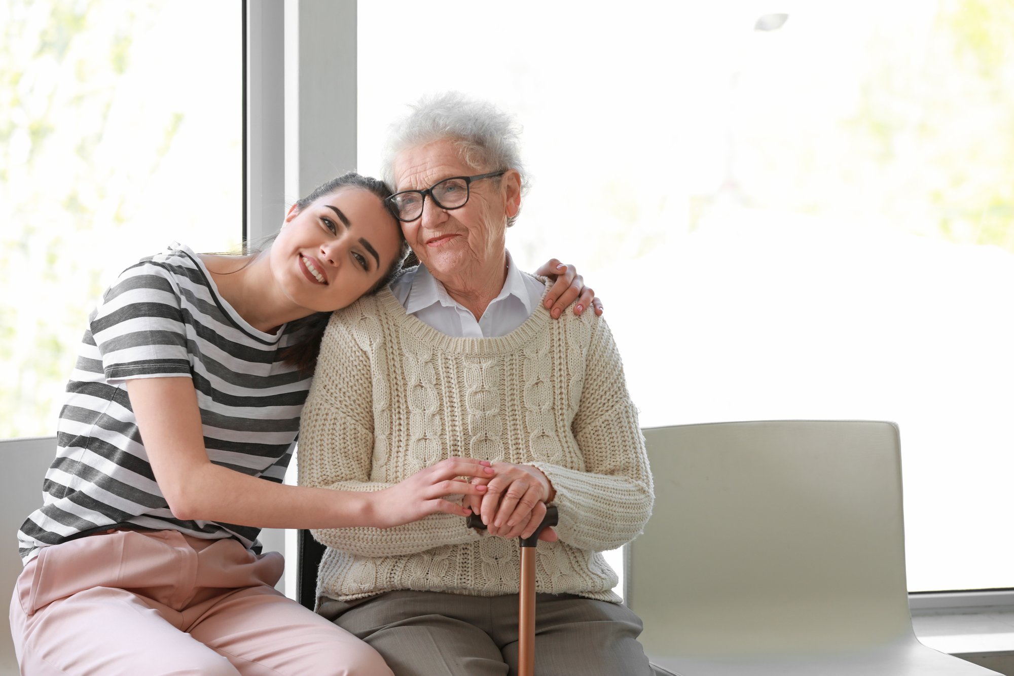 Younger woman hugging older woman