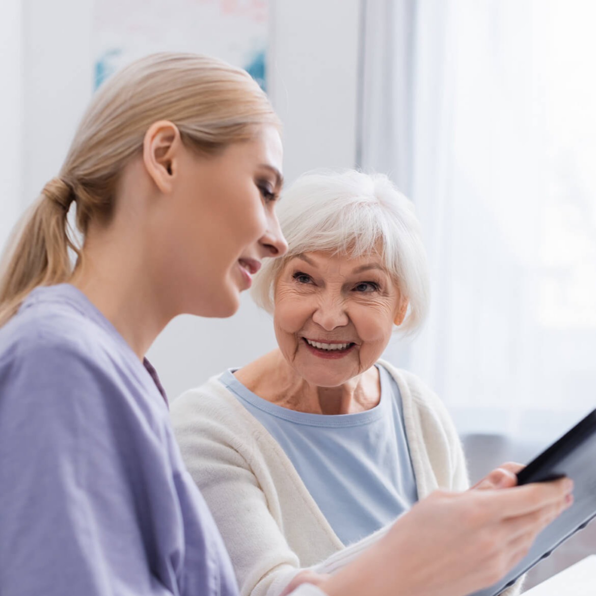 Female doctor explaining medical information to older female patient