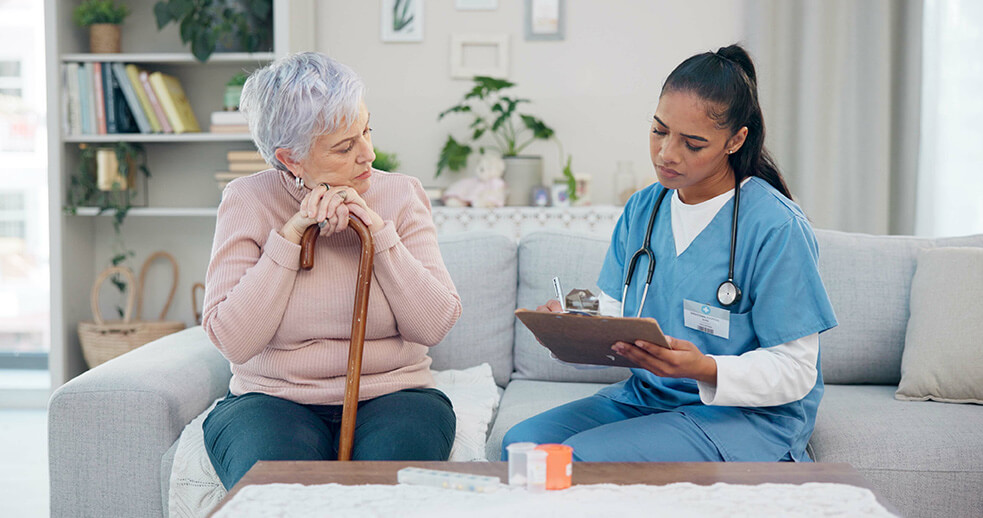 Female nurse going through a checklist with her female patient